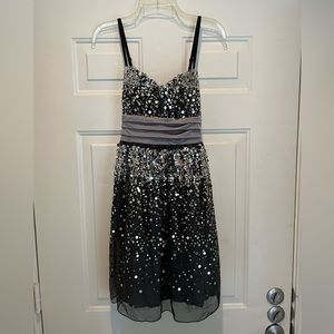 Party dress size 9 with sequins and tie back